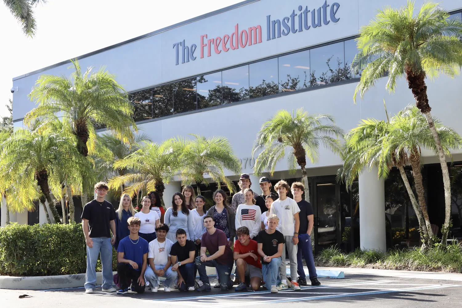 Freedom Institute students in front of the campus